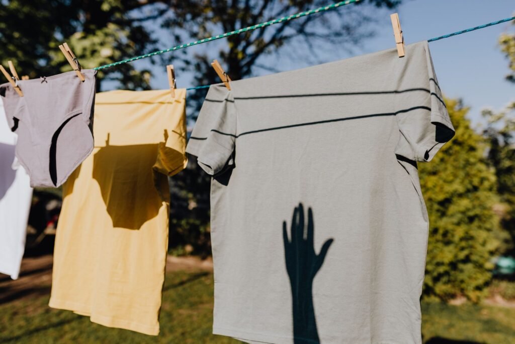 Clean clothes hanging on a line to dry outdoors