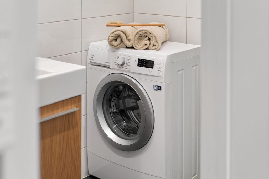 Clean laundry space with a white washing machine, relevant to a Samsung washer dC or dE error