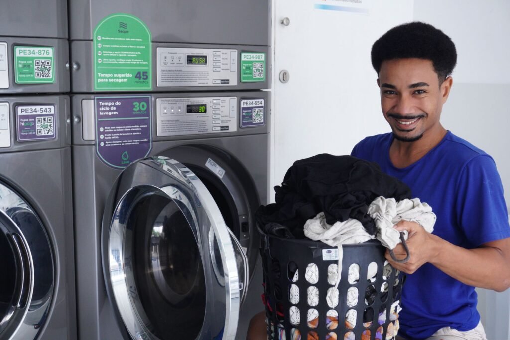 Person holding a laundry basket ready to wash clothes