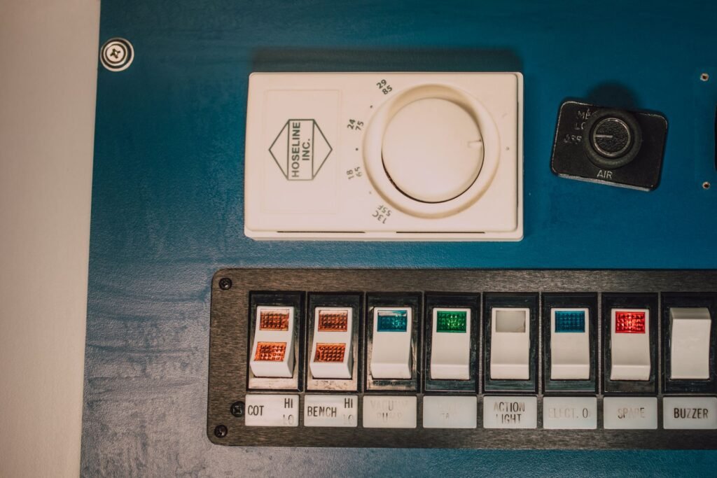 Close-up of a control panel with switches and a dial