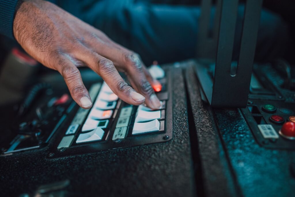 Close-up of a hand adjusting switches on a control panel, relevant to a Samsung washer AC communication error