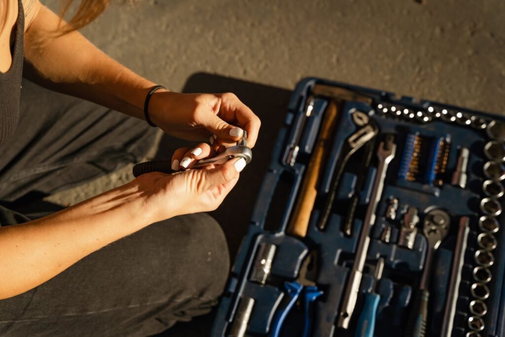 Hands using tools in a workshop setting