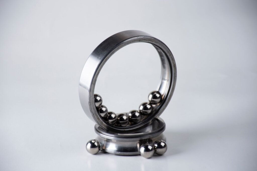 A stainless steel ball bearing with its rolling elements exposed, the kind of worn support part behind a grinding dryer