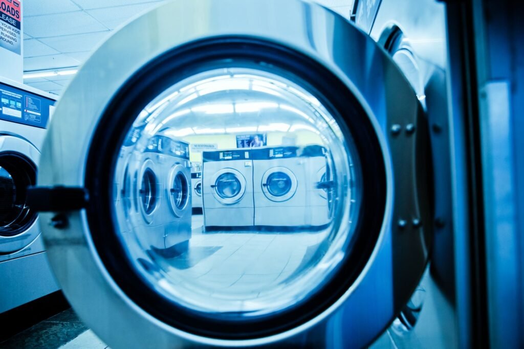 The view out through the open door of a front-load washer, showing the door ring the rubber gasket sits behind