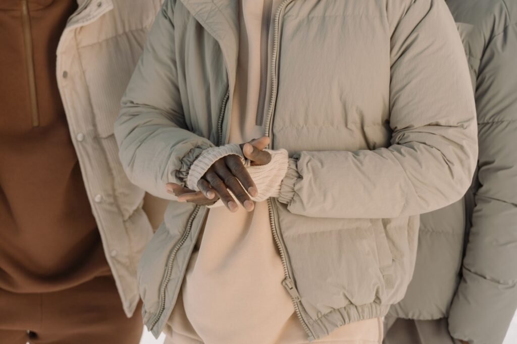 Close-up of quilted puffer jackets showing the stitched baffles that hold the insulation in place